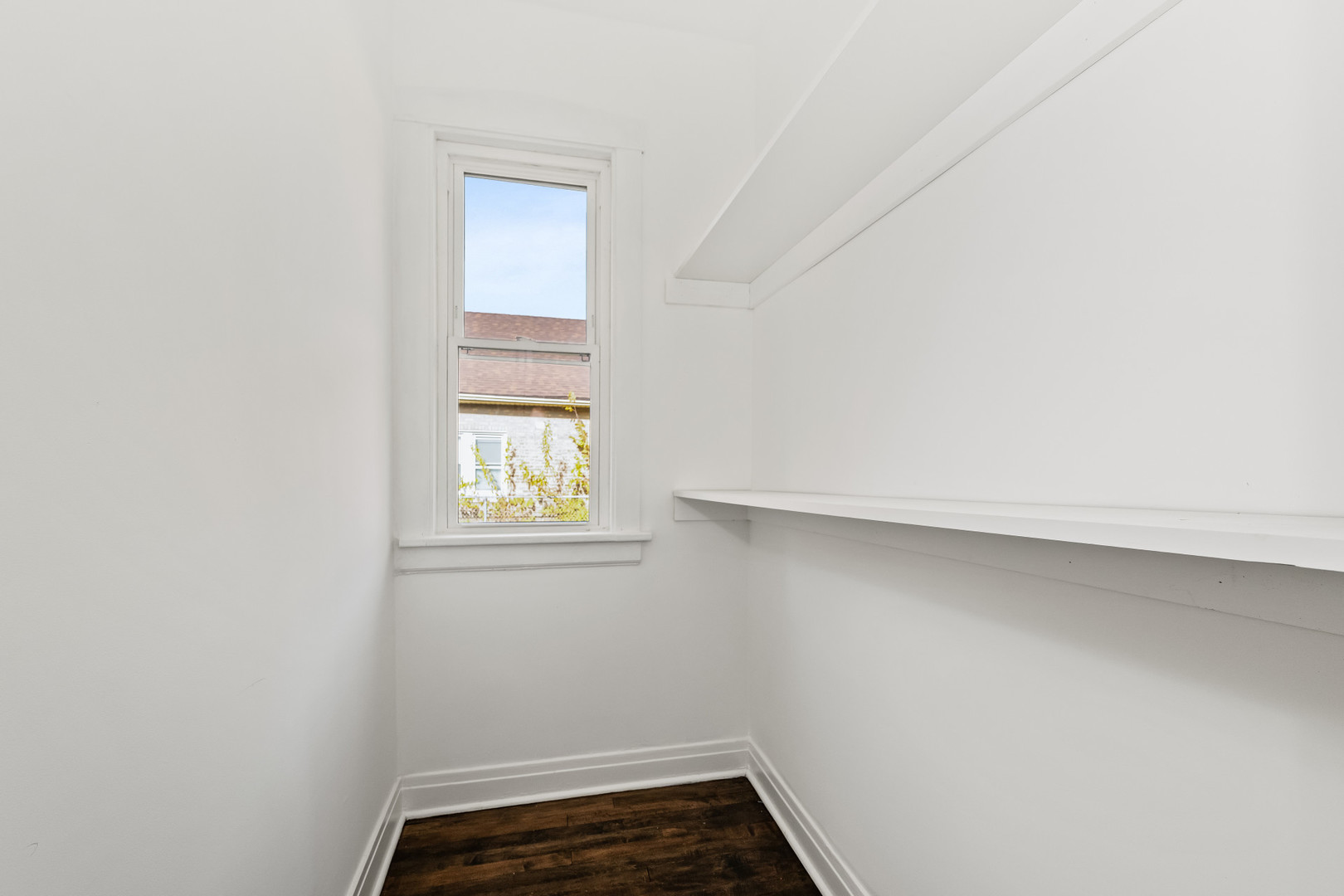 7832 South Paxton Avenue Chicago, IL 60649 - Photo 16 of 59 an empty room with a window