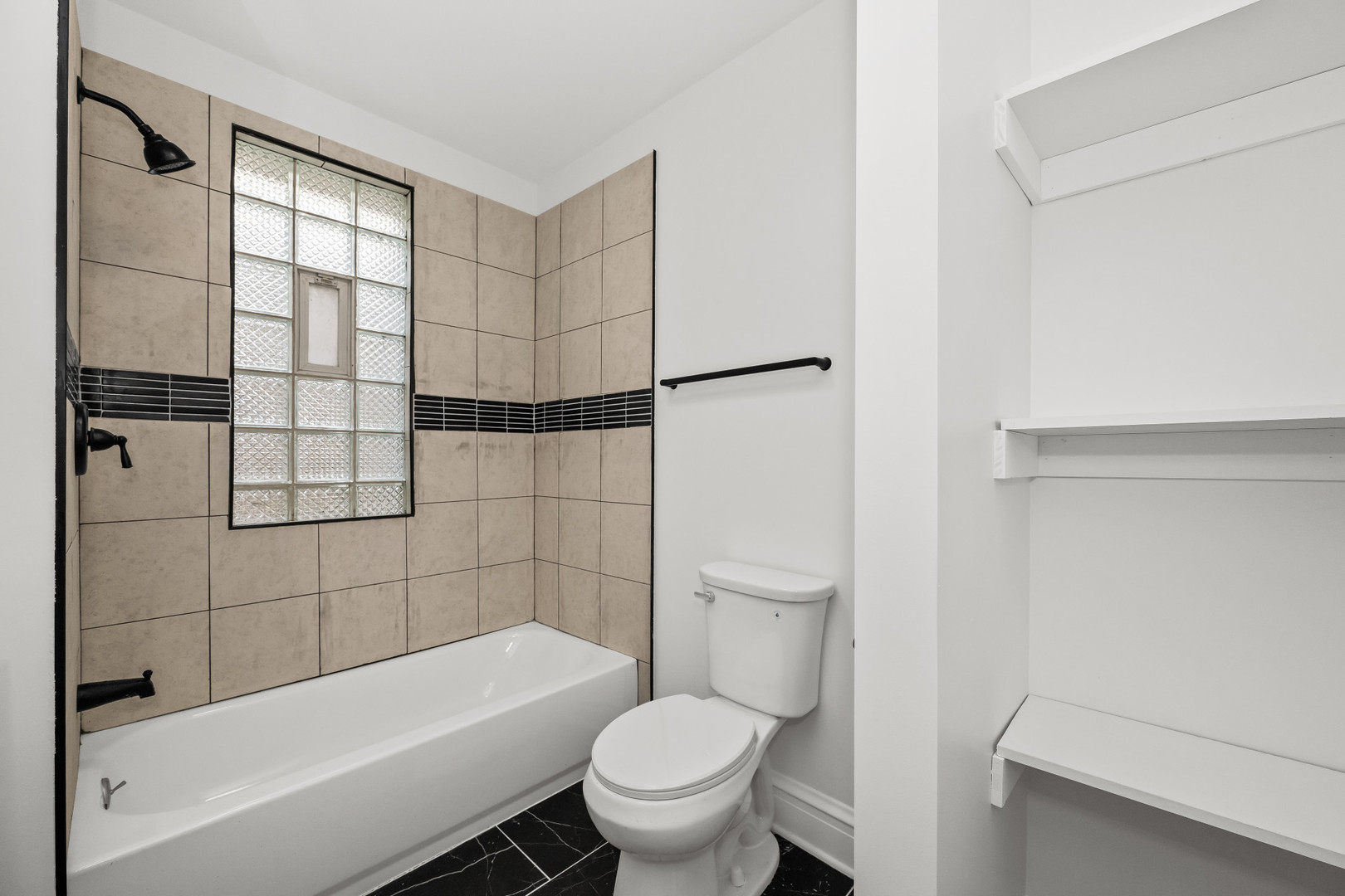 7832 South Paxton Avenue Chicago, IL 60649 - Photo 24 of 59 a bathroom with a toilet and a bathtub
