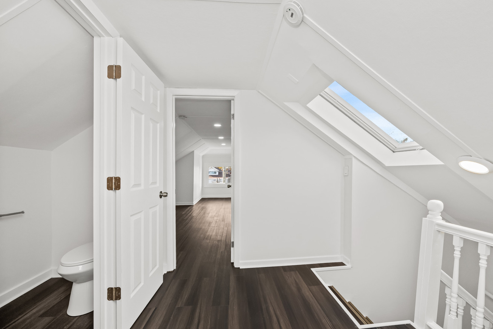 7832 South Paxton Avenue Chicago, IL 60649 - Photo 27 of 59 a view of a hallway with wooden floor and staircase