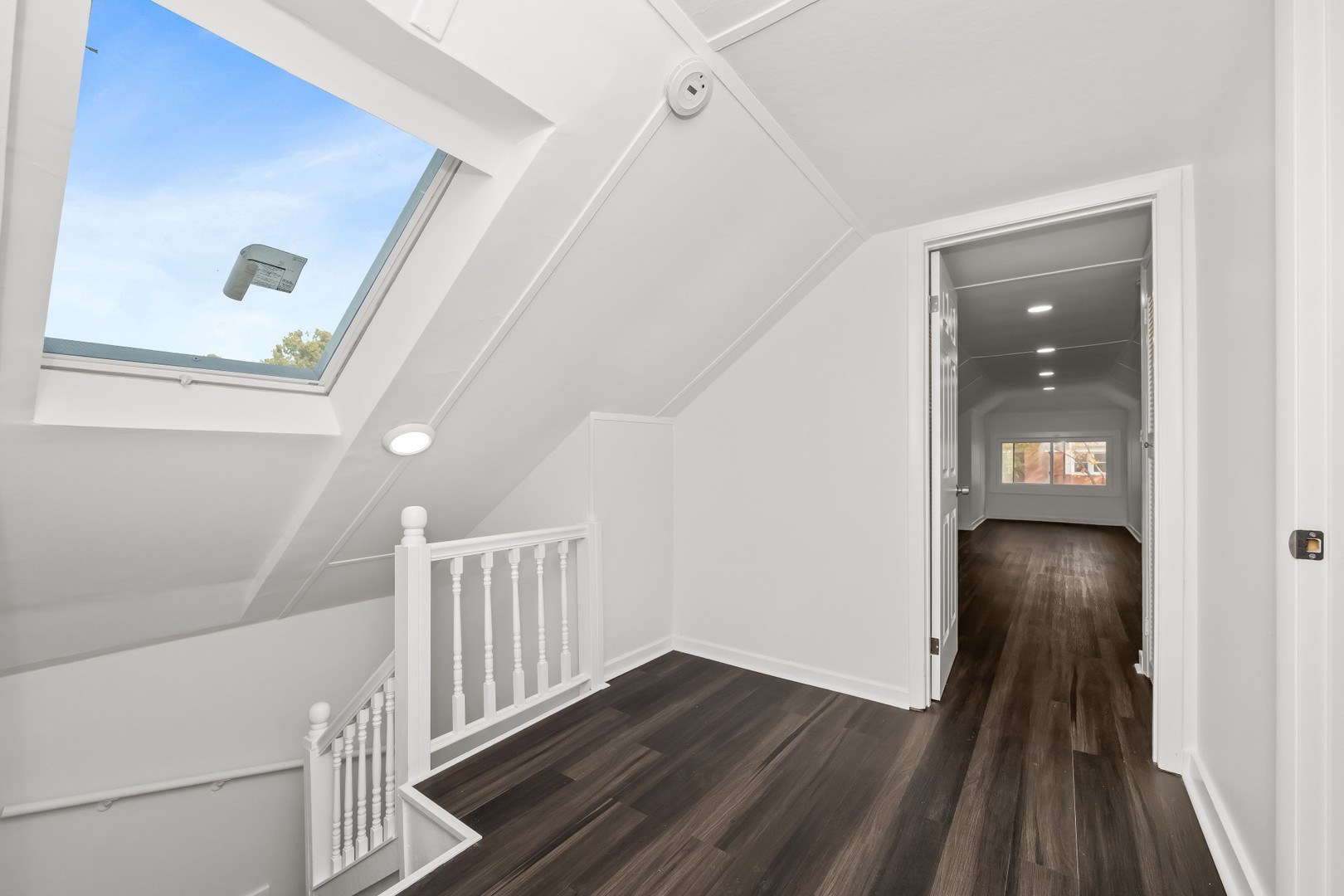 7832 South Paxton Avenue Chicago, IL 60649 - Photo 28 of 59 a view of a hallway and wooden floor with entryway