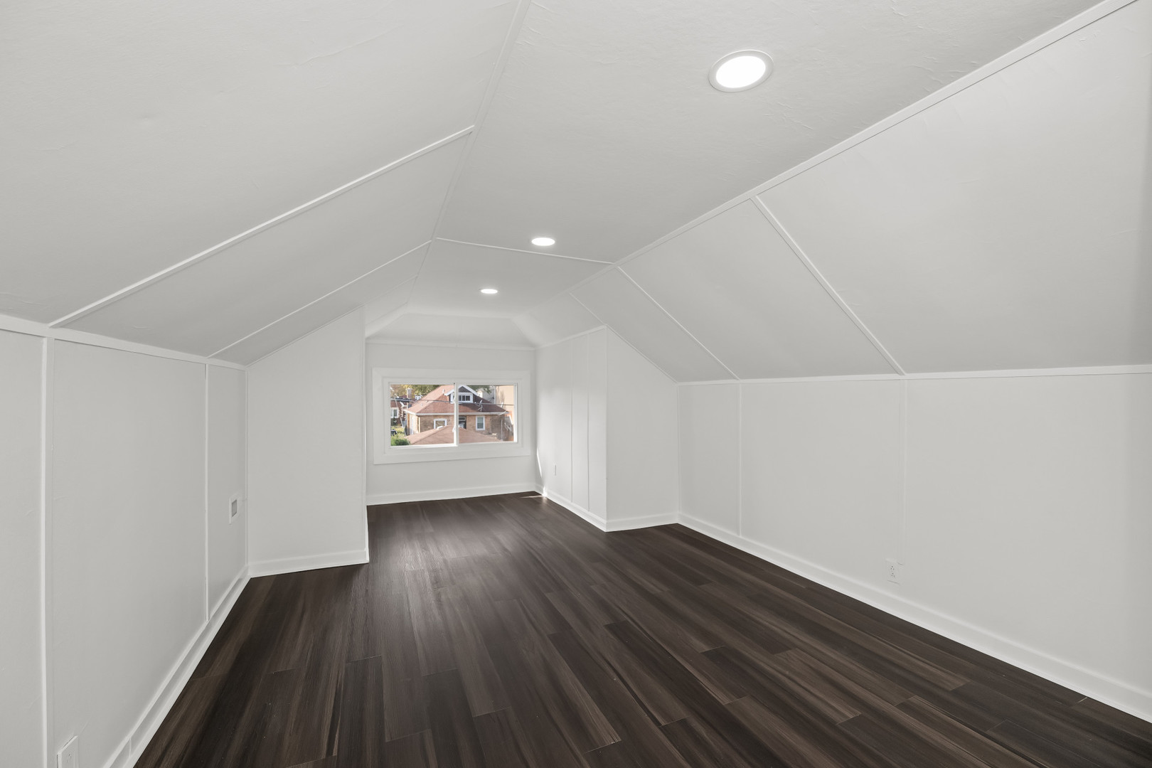 7832 South Paxton Avenue Chicago, IL 60649 - Photo 30 of 59 an empty room with wooden floor and windows