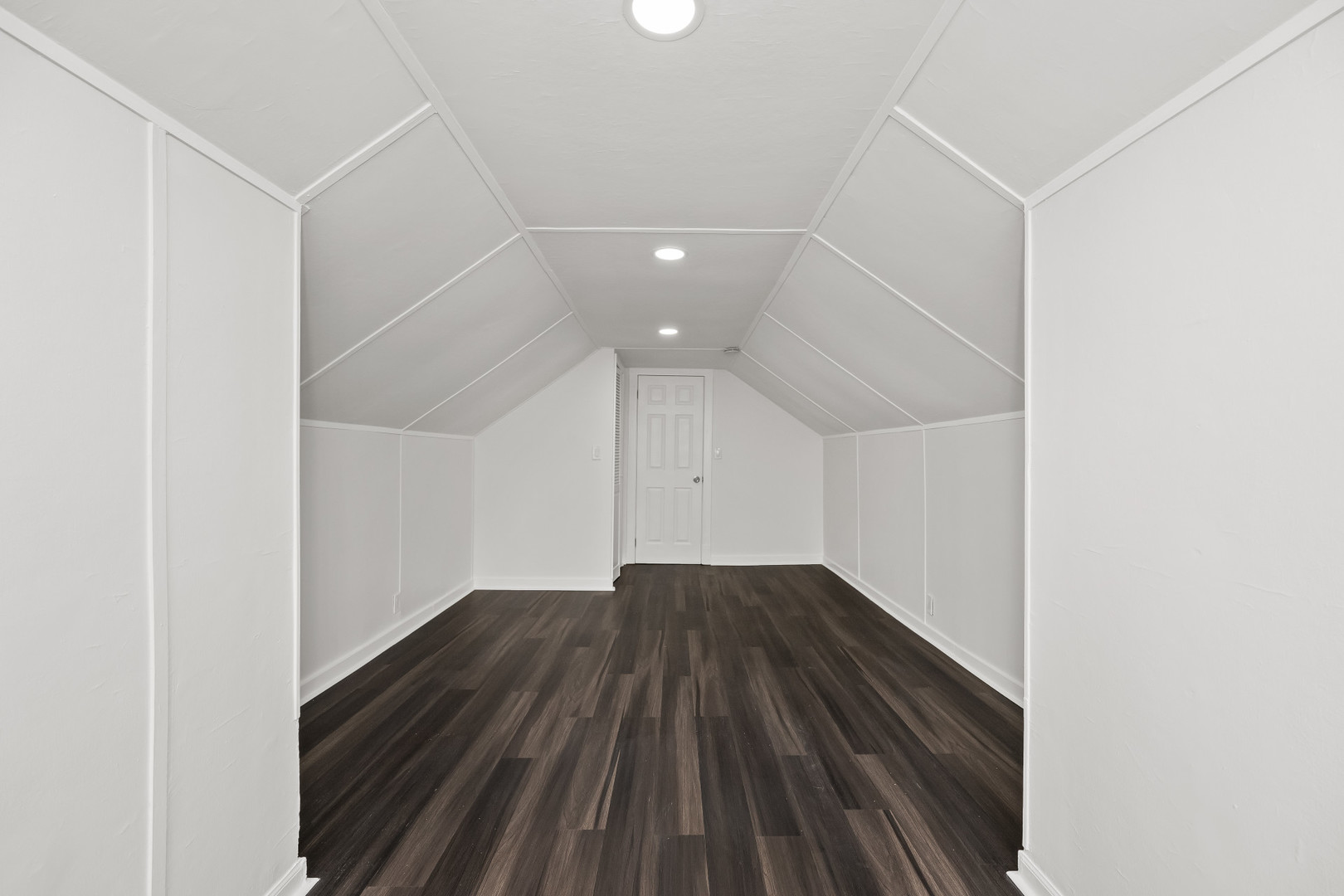 7832 South Paxton Avenue Chicago, IL 60649 - Photo 34 of 59 an empty room with wooden floor and windows