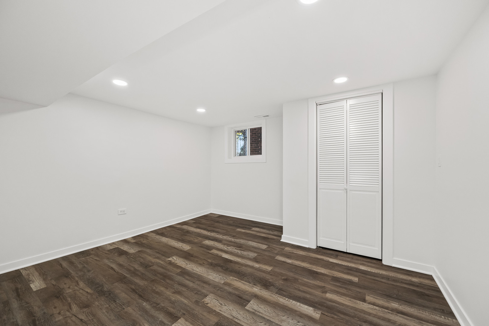 7832 South Paxton Avenue Chicago, IL 60649 - Photo 36 of 59 a view of an empty room with wooden floor