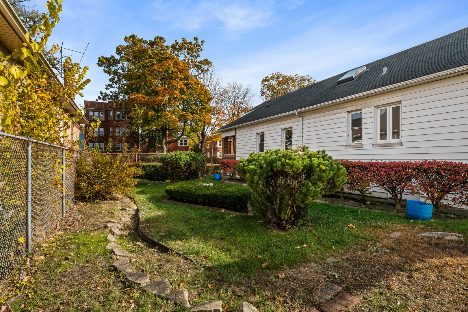 7832 South Paxton Avenue Chicago, IL 60649 - Photo 55 of 59 a view of a house with backyard and garden