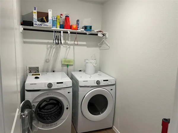 a bathroom with a toilet sink and shower