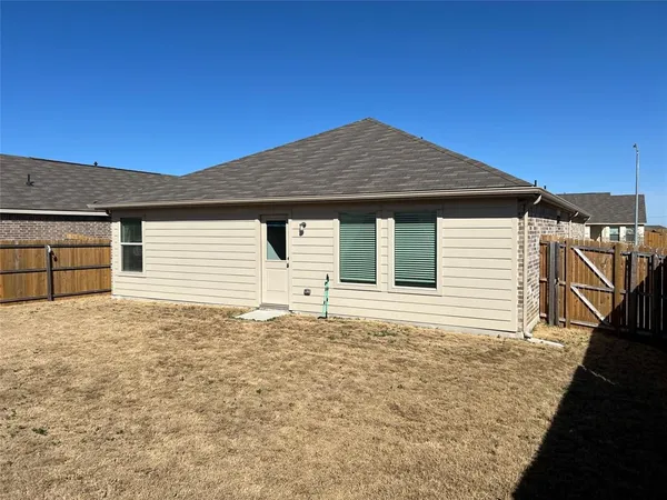 a house with yard in front of it