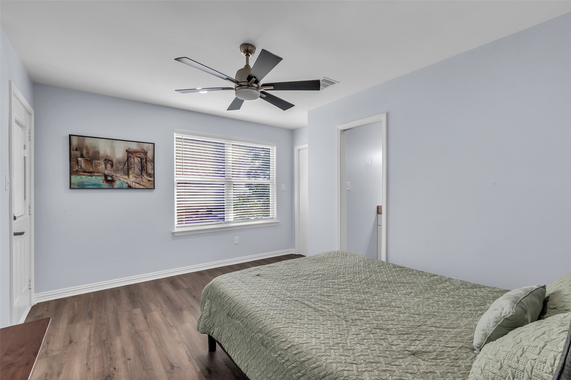 197 Rain Forest Road Onalaska, TX 77360 - Photo 19 of 25 a bedroom with a bed and a window