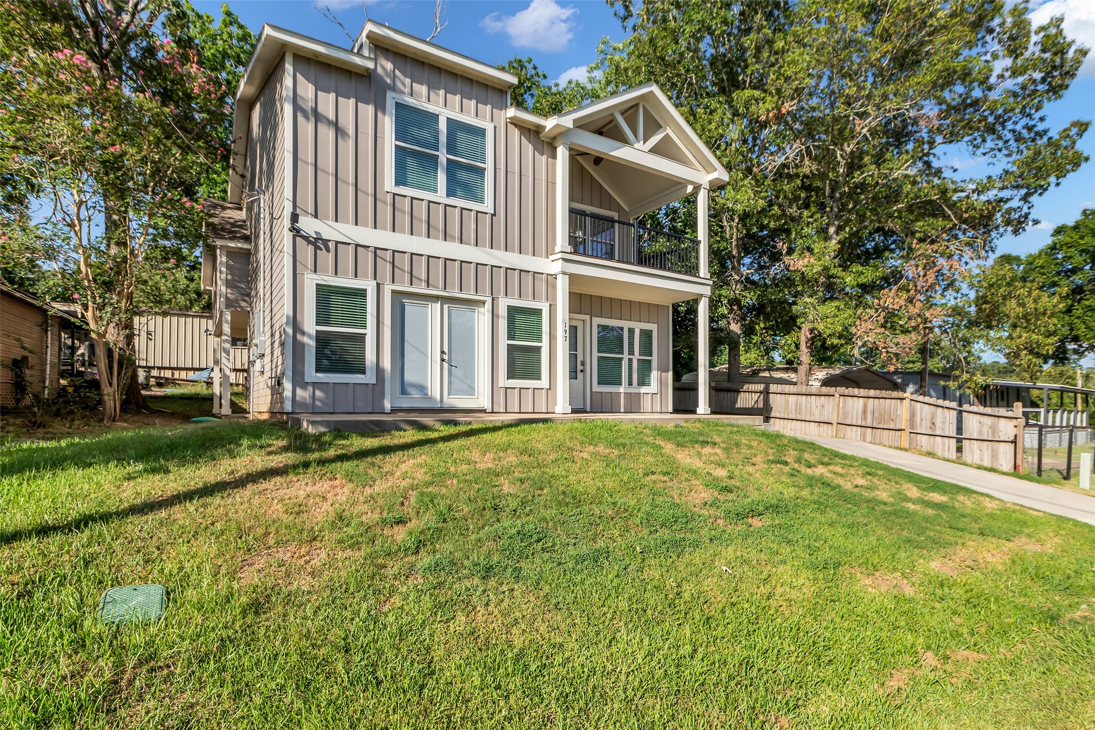 197 Rain Forest Road Onalaska, TX 77360 - Photo 25 of 25 a view of a house with a backyard