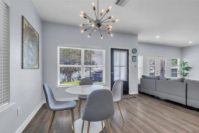 a dining room with furniture and window