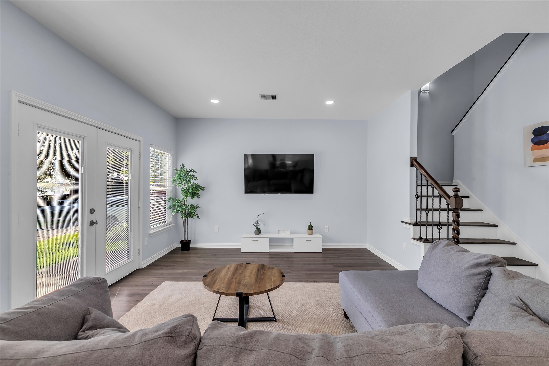 197 Rain Forest Road Onalaska, TX 77360 - Photo 7 of 25 a living room with furniture and a flat screen tv