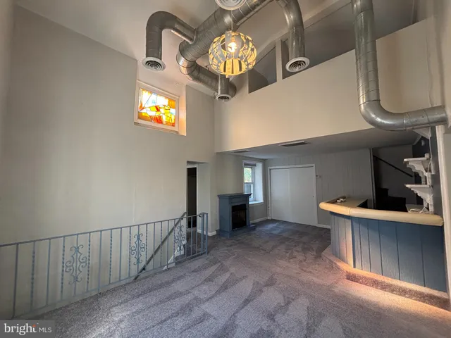 a view of entryway and kitchen