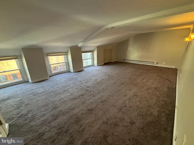 a view of empty room with windows