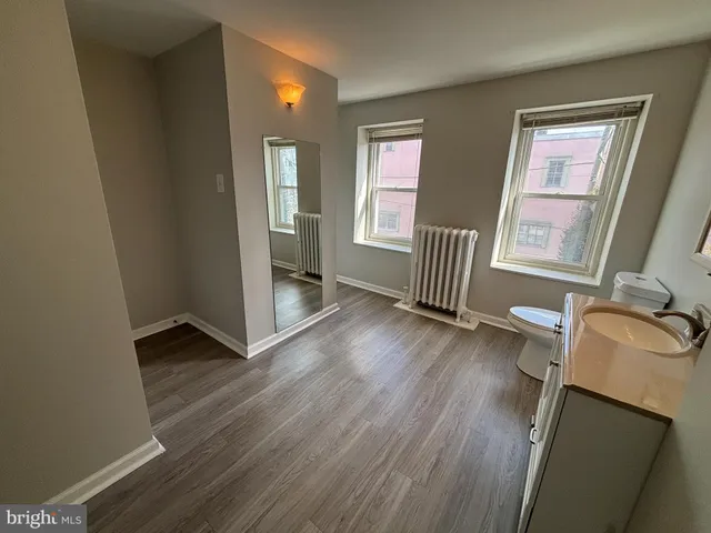a bathroom with a glass shower door