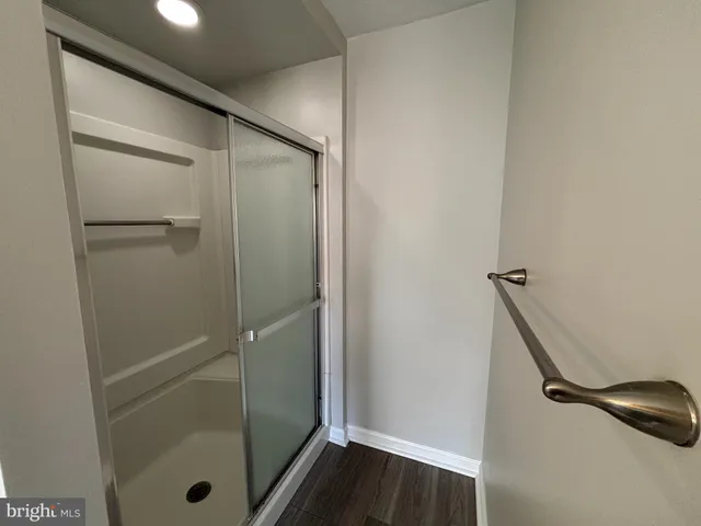 a bathroom with a glass door