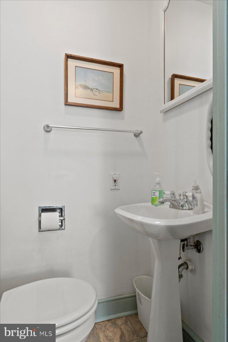 215 Nockamixon Road Kintnersville, PA 18930 - Photo 21 of 55 a bathroom with a toilet a sink and mirror