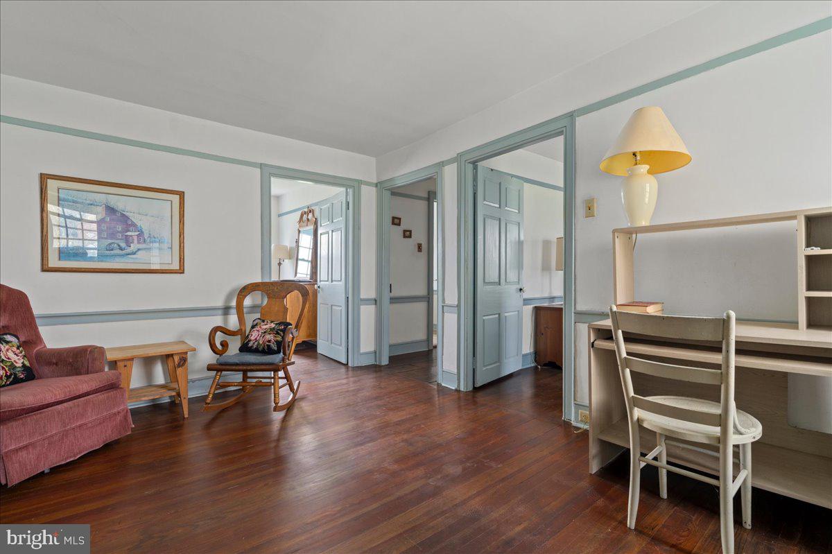 215 Nockamixon Road Kintnersville, PA 18930 - Photo 22 of 55 a living room with furniture and wooden floor