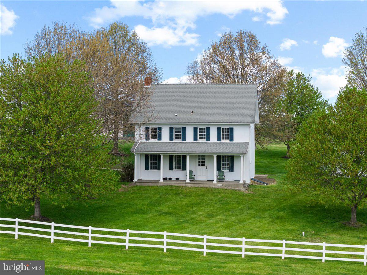 215 Nockamixon Road Kintnersville, PA 18930 - Photo 6 of 55 a view of a house with a big yard and palm trees