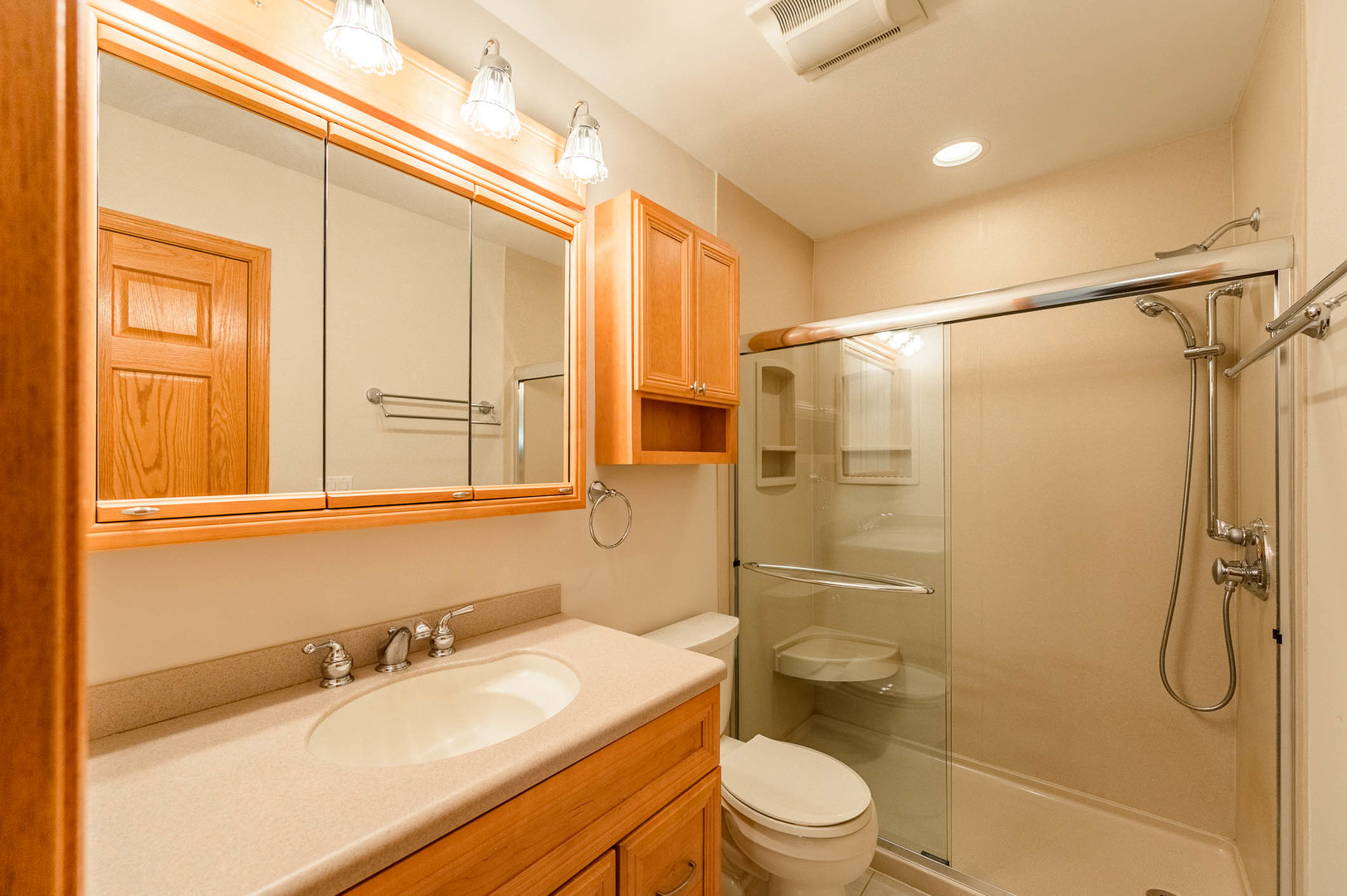 638 Colony Avenue Lindenhurst, IL 60046 - Photo 11 of 15 a bathroom with a granite countertop sink toilet and shower