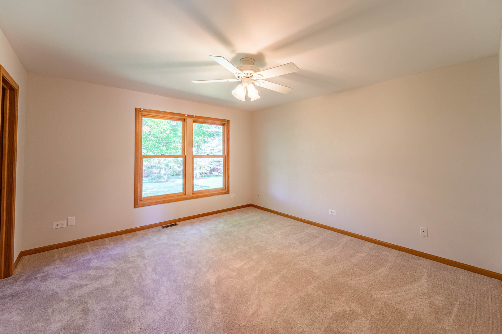 638 Colony Avenue Lindenhurst, IL 60046 - Photo 8 of 15 an empty room with windows and fan