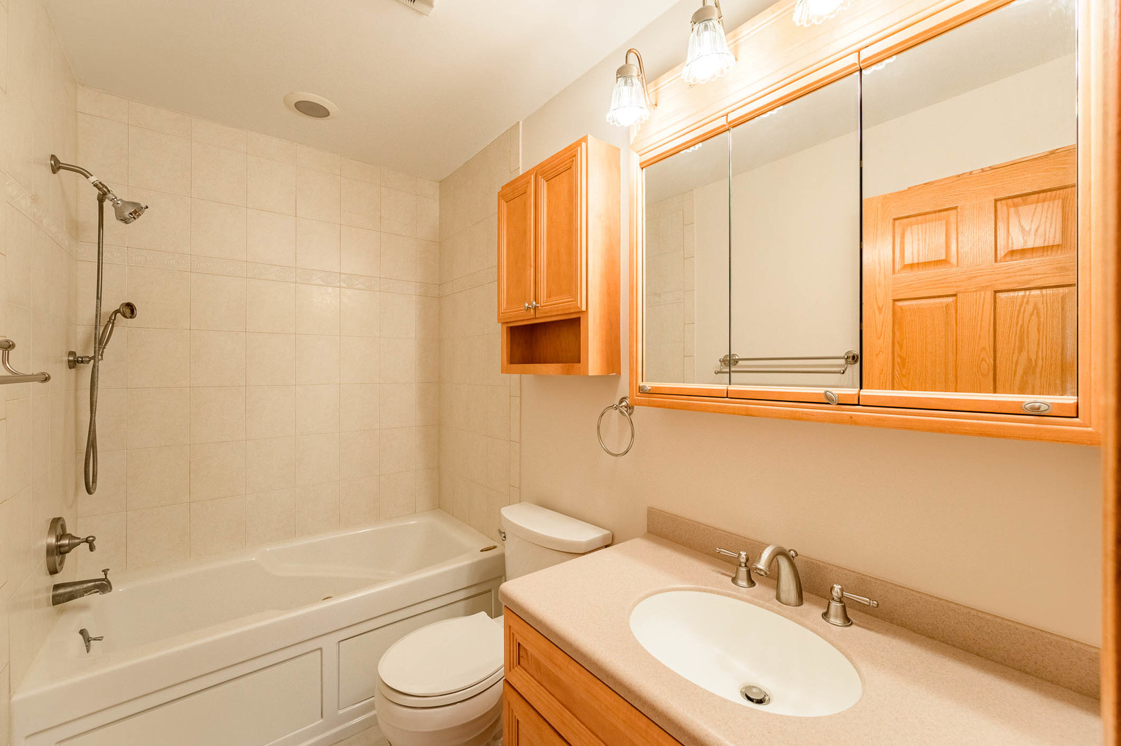 638 Colony Avenue Lindenhurst, IL 60046 - Photo 10 of 15 a bathroom with a sink toilet and shower