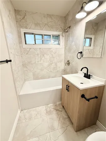 a bathroom with a sink and a bathtub