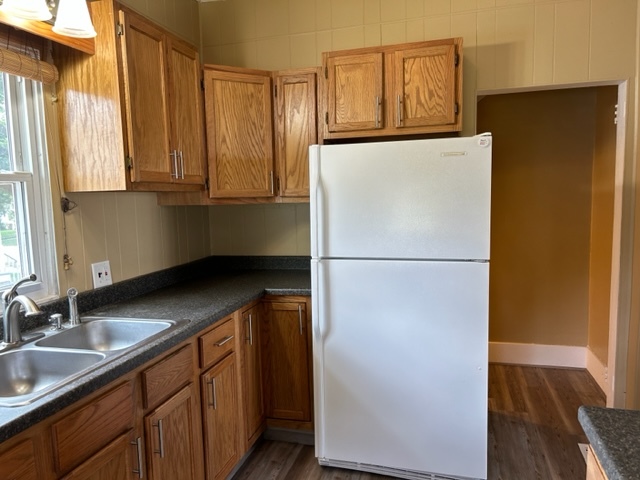 404 South Hall Street Morrison, IL 61270 - Photo 14 of 25 a kitchen with granite countertop a refrigerator and a sink