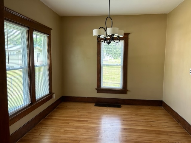 404 South Hall Street Morrison, IL 61270 - Photo 15 of 25 a view of a room with a window and wooden floor