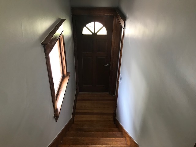 404 South Hall Street Morrison, IL 61270 - Photo 18 of 25 a view of a hallway with wooden floor and a mirror