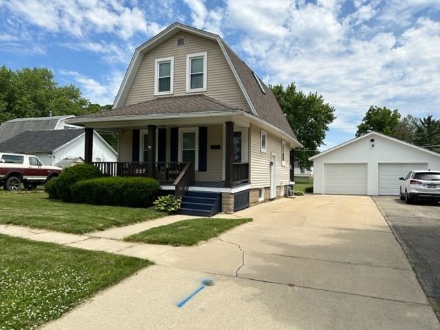 404 South Hall Street Morrison, IL 61270 - Photo 2 of 25 a front view of a house with a yard and garage