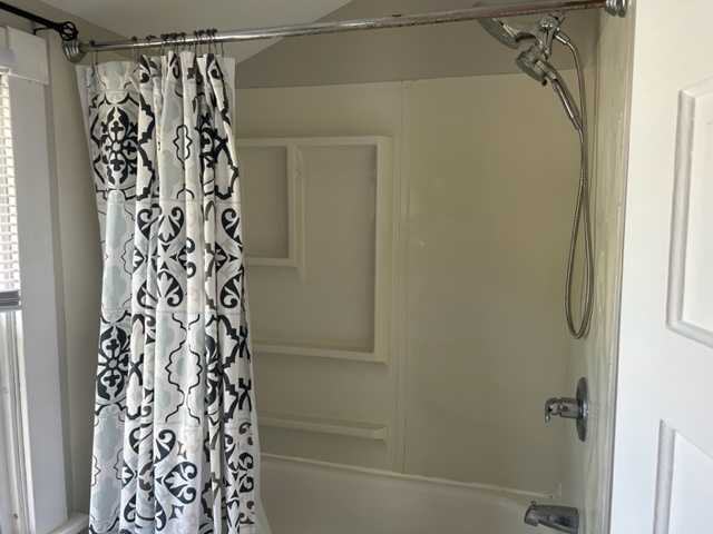 404 South Hall Street Morrison, IL 61270 - Photo 24 of 25 a bathroom with a shower curtain and a window