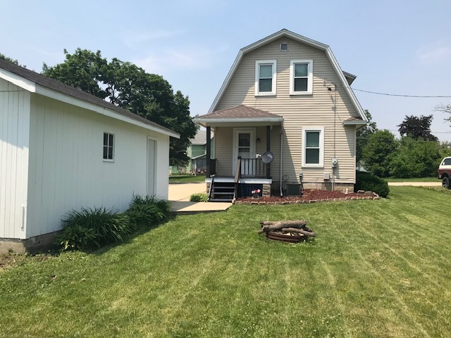 404 South Hall Street Morrison, IL 61270 - Photo 9 of 25 a front view of house with yard and outdoor seating