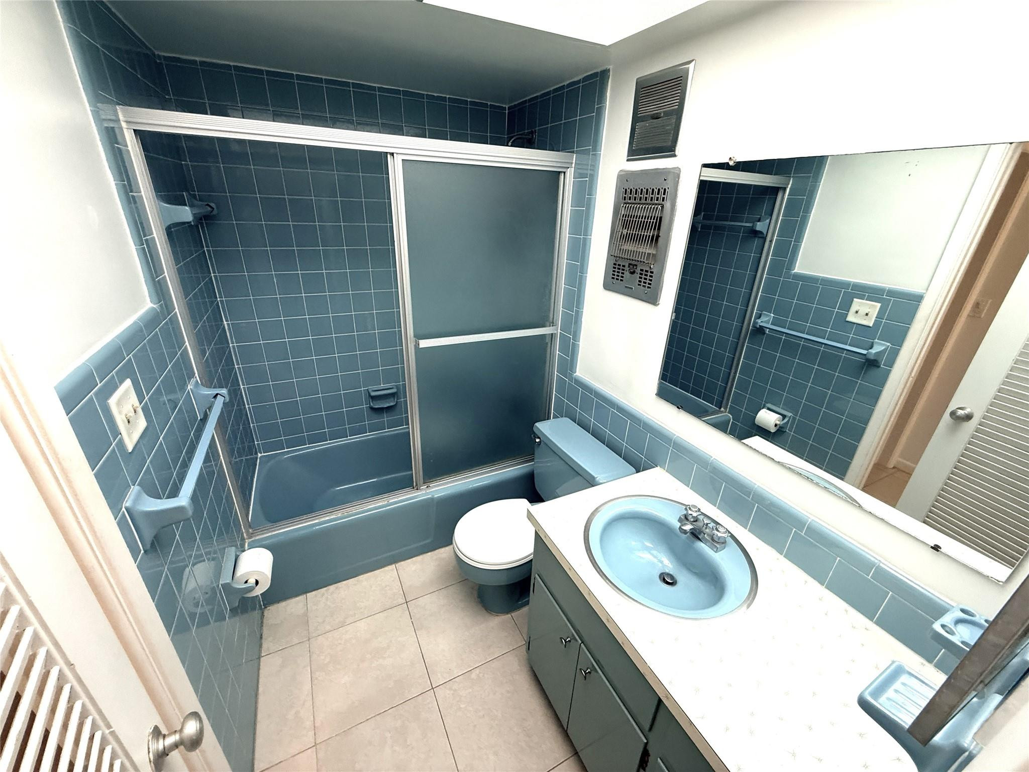 3205 Colony Club Road, Unit 1 Pompano Beach, FL 33062 - Photo 12 of 12 a bathroom with a sink a toilet and shower