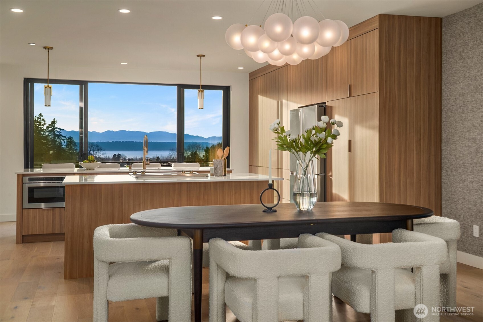 a kitchen with a table and chairs in it