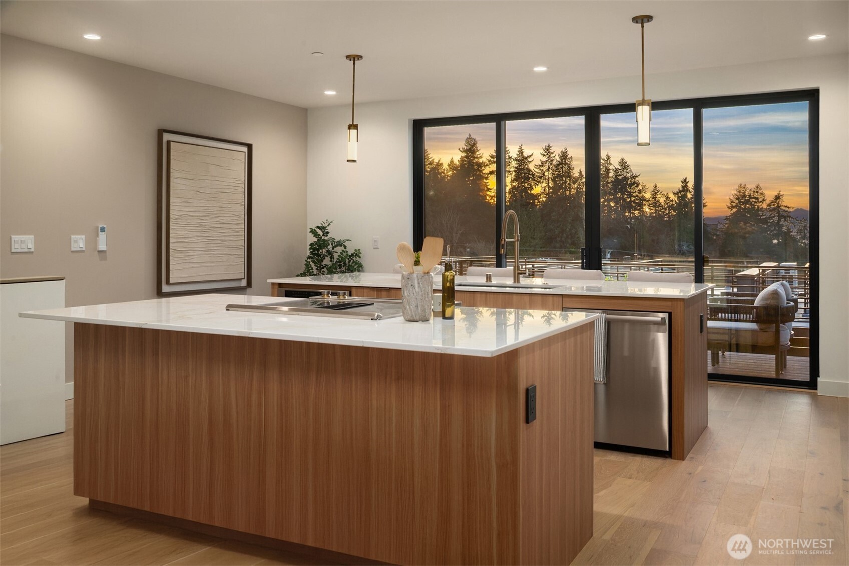 614 5th Avenue South, Unit A103 Edmonds, WA 98020 - Photo 11 of 28 a kitchen with stainless steel appliances granite countertop a sink and a large window