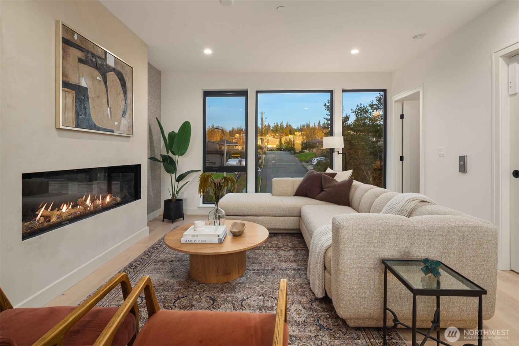 614 5th Avenue South, Unit A103 Edmonds, WA 98020 - Photo 17 of 28 a living room with furniture and a fireplace