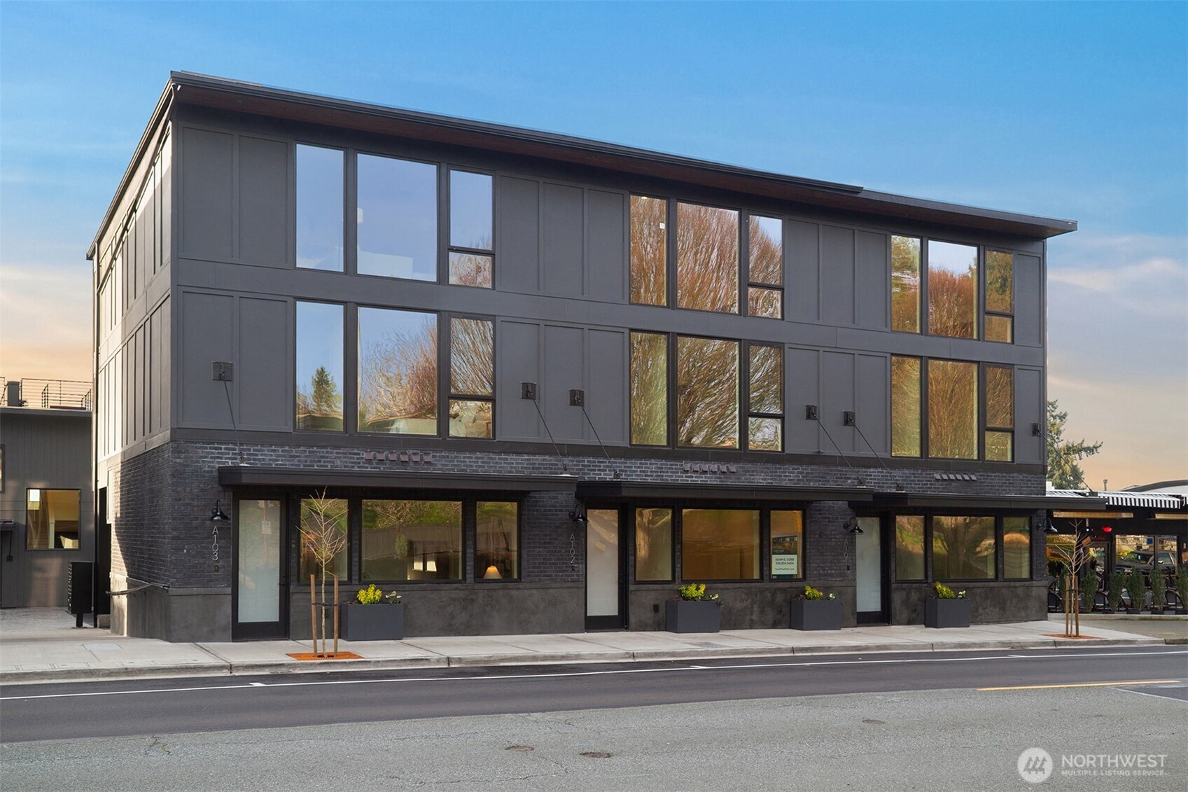 614 5th Avenue South, Unit A103 Edmonds, WA 98020 - Photo 2 of 28 a building that has a lots of windows