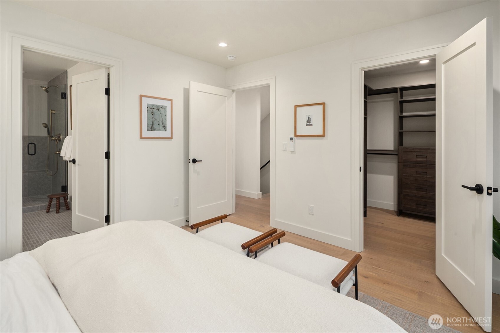 614 5th Avenue South, Unit A103 Edmonds, WA 98020 - Photo 21 of 28 a bedroom with a bed and a view of bathroom