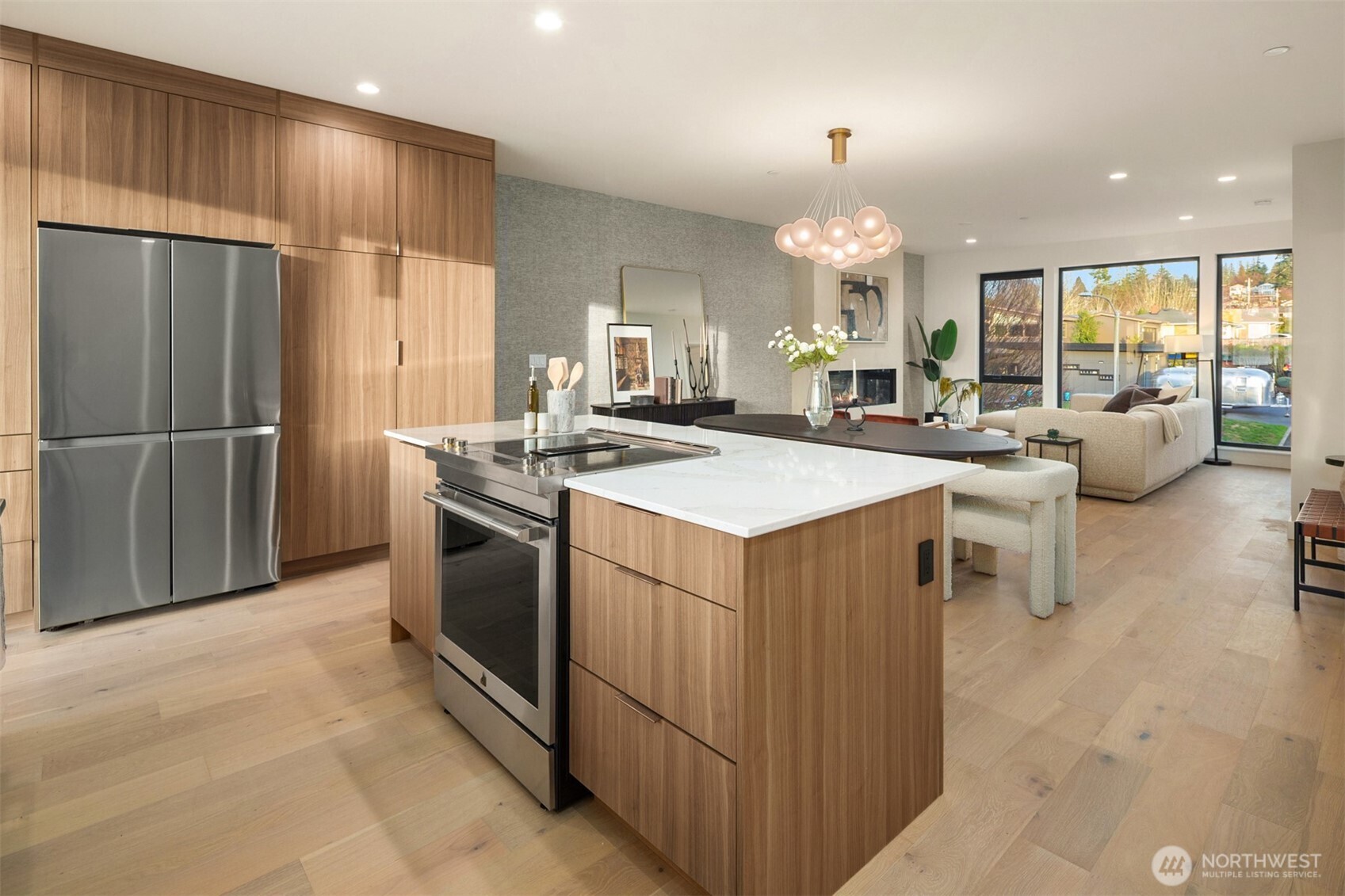 614 5th Avenue South, Unit A103 Edmonds, WA 98020 - Photo 3 of 28 a kitchen with a stove a refrigerator and a fireplace