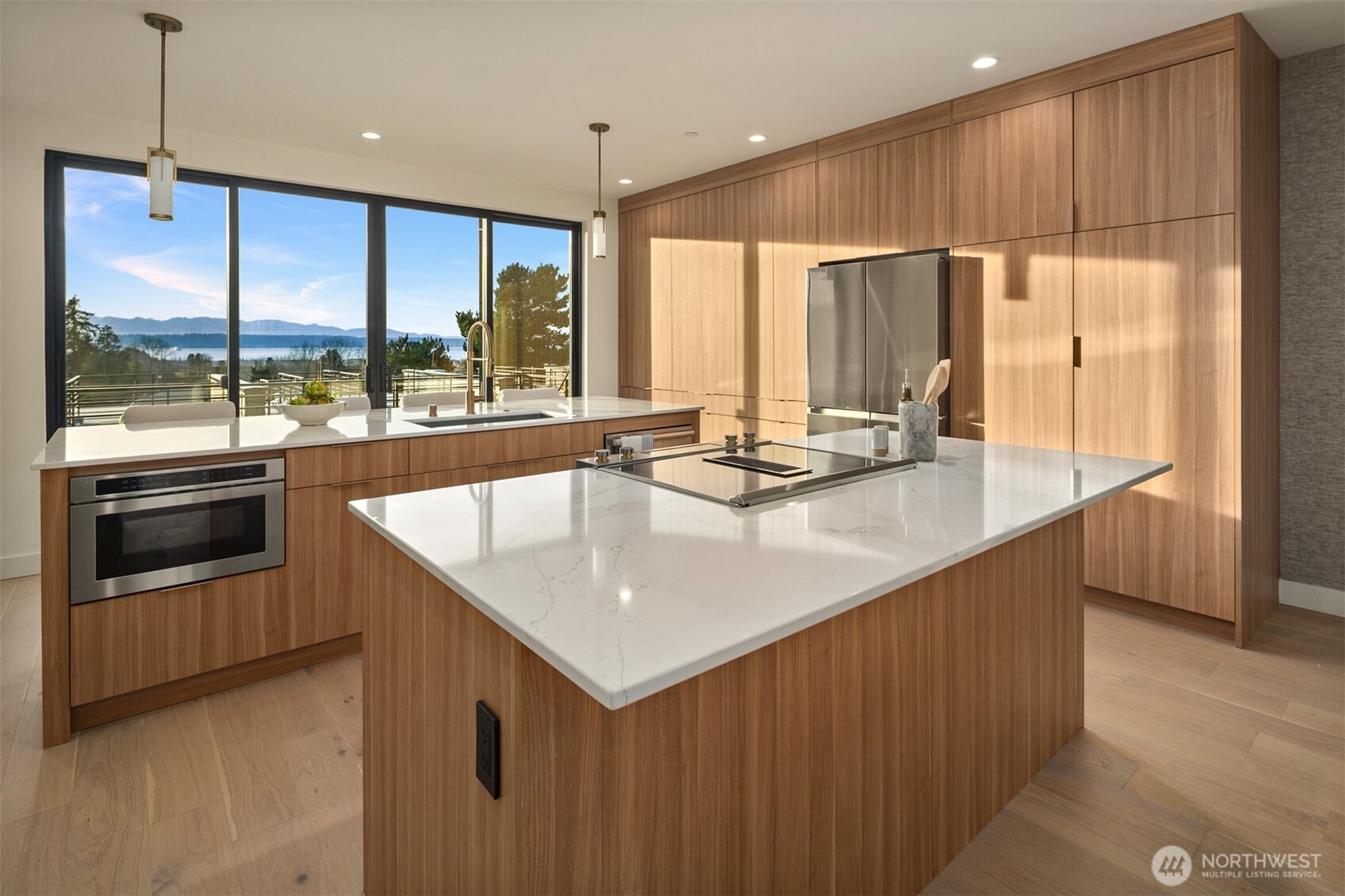 614 5th Avenue South, Unit A103 Edmonds, WA 98020 - Photo 4 of 28 a kitchen with kitchen island a large window in it