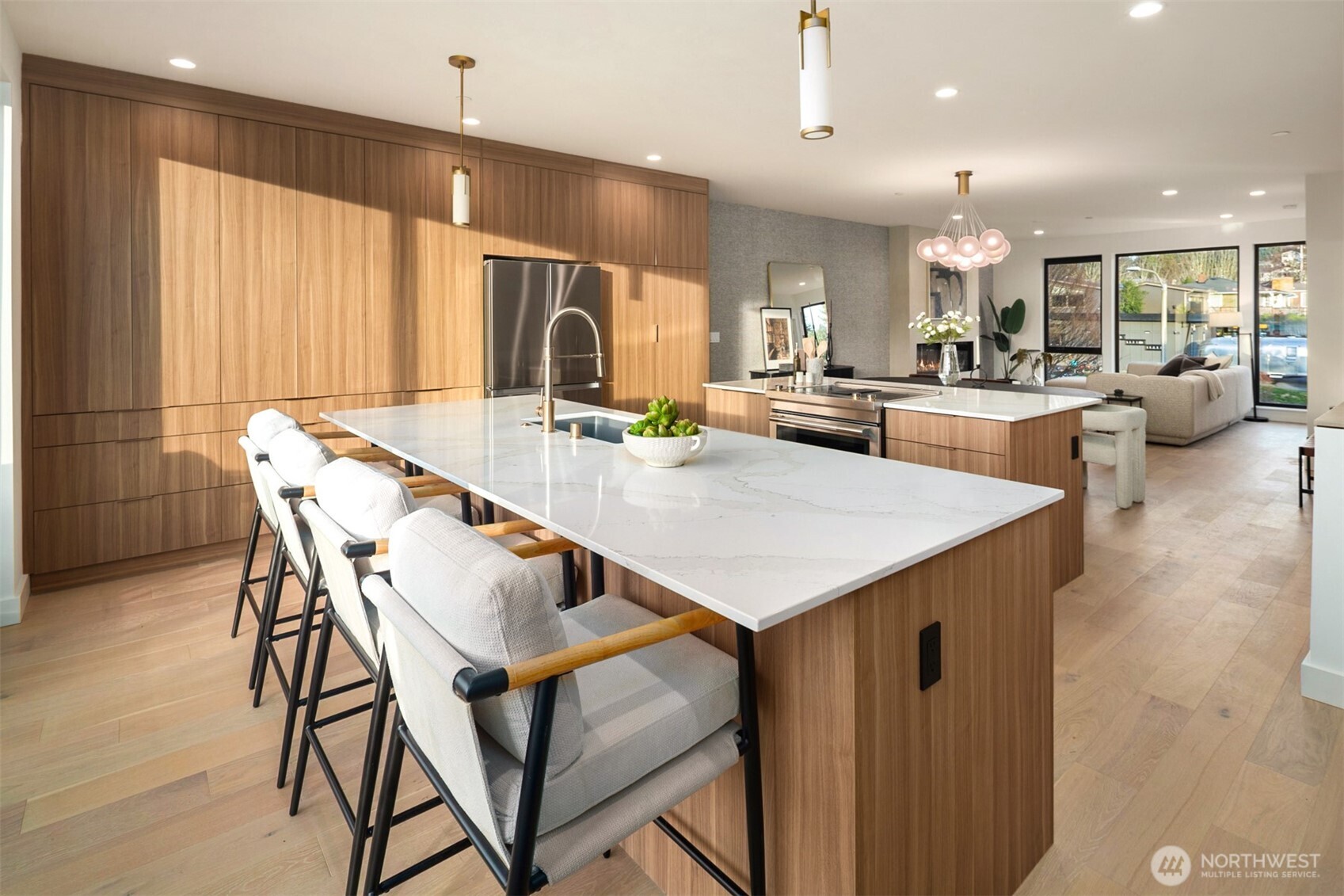 614 5th Avenue South, Unit A103 Edmonds, WA 98020 - Photo 9 of 28 a dining hall with stainless steel appliances kitchen island a table and chairs