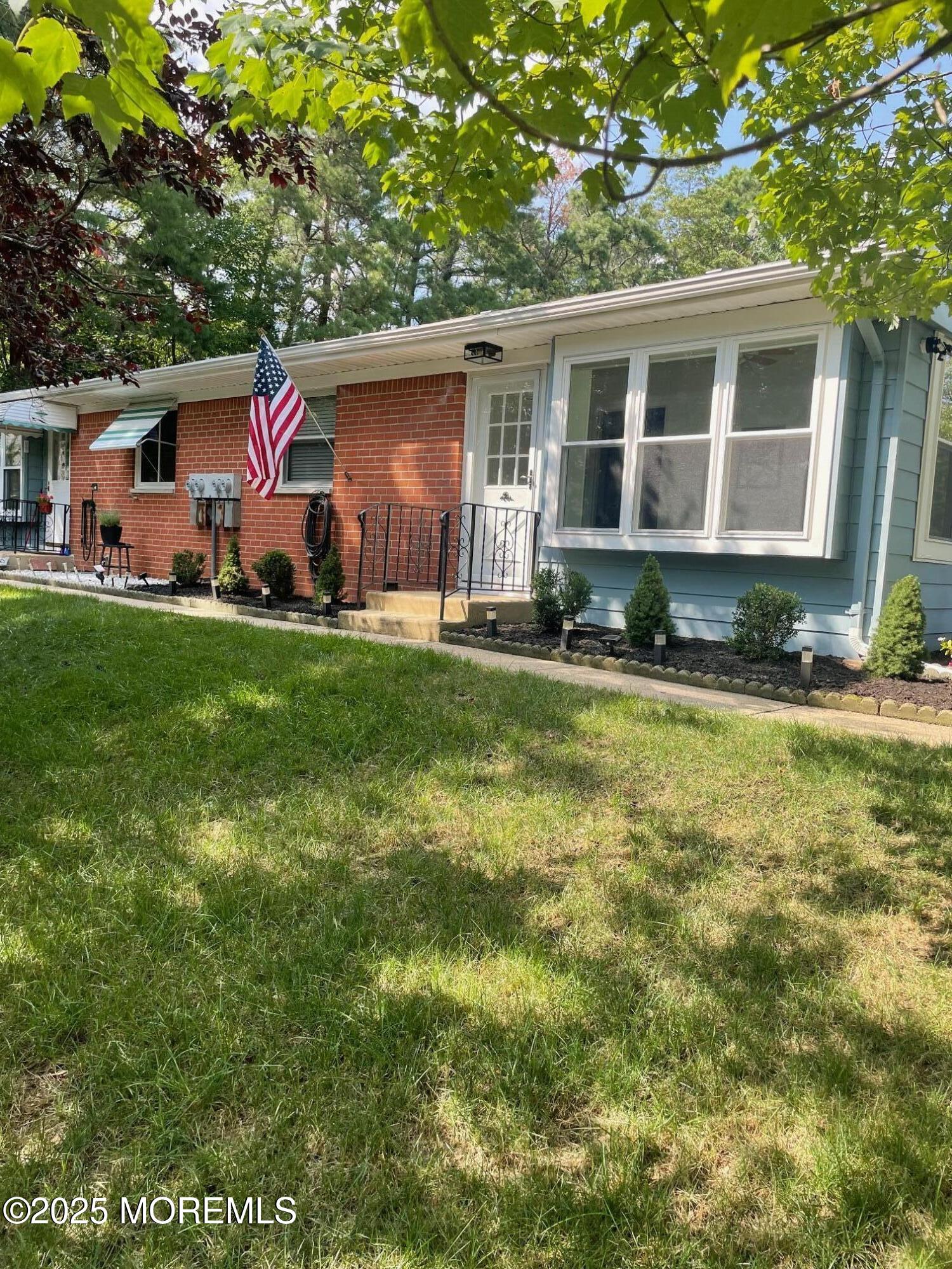 18 Valley Forge Drive, Unit A Whiting, NJ 08759 - Photo 2 of 22 a front view of house with yard and green space