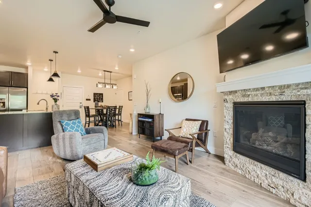 a living room with furniture and a fireplace