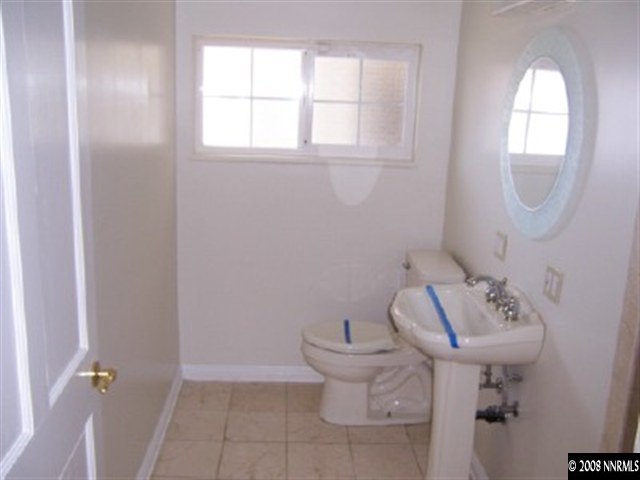 645 Starlight Circle Reno, NV 89509 - Photo 5 of 9 a bathroom with a sink toilet and a mirror