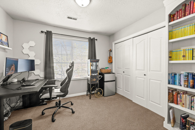 174 Rockey Park Lane, Unit 34 Draper, UT 84020 - Photo 8 of 20 Office area with light carpet and a textured ceiling