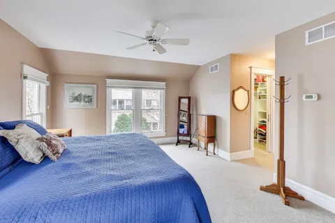 a bed room with a bed and window