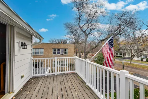 a view of deck with wooden floor and fence and a wooden floor