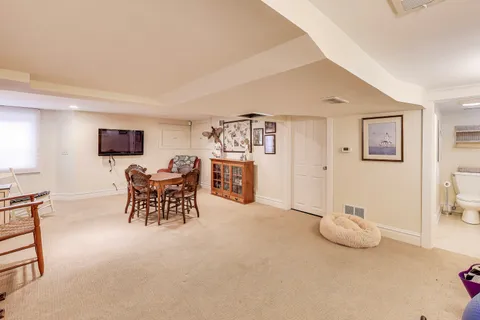a view of a livingroom with furniture and a window