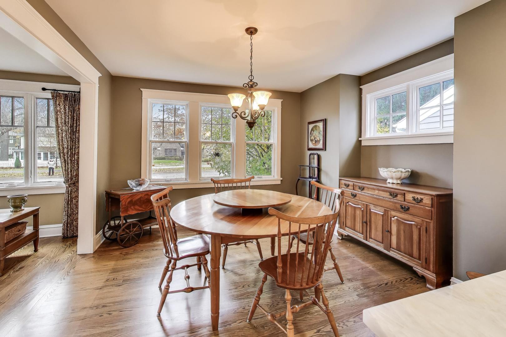 228 East Center Avenue Lake Bluff, IL 60044 - Photo 7 of 39 a dining room with furniture a chandelier and wooden floor