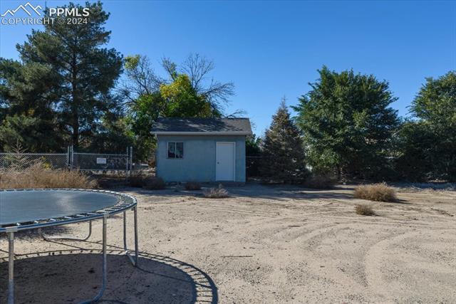 28079 Iris Road Pueblo, CO 81006 - Photo 39 of 50 View of yard featuring a shed