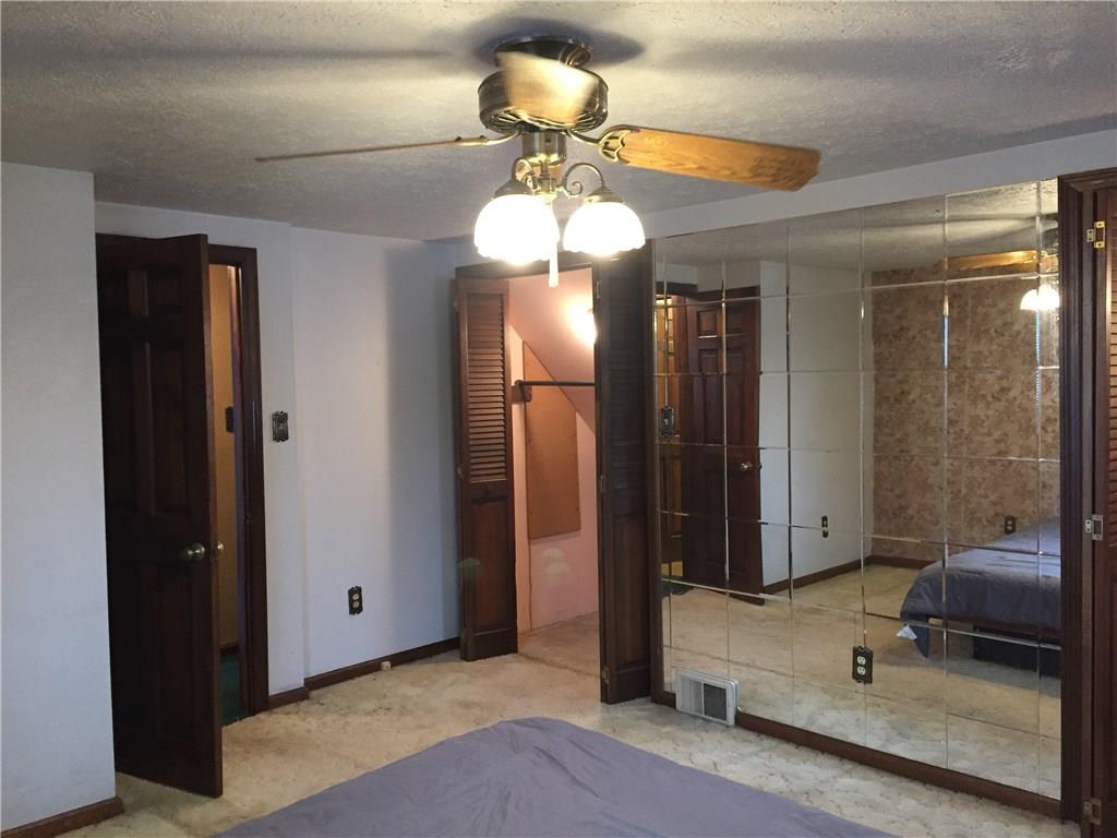 54 May Avenue McKees Rocks, PA 15136 - Photo 15 of 21 Master bedroom has closet with two doors that spans behind the wall